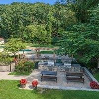 A backyard with a fire pit and seating area.